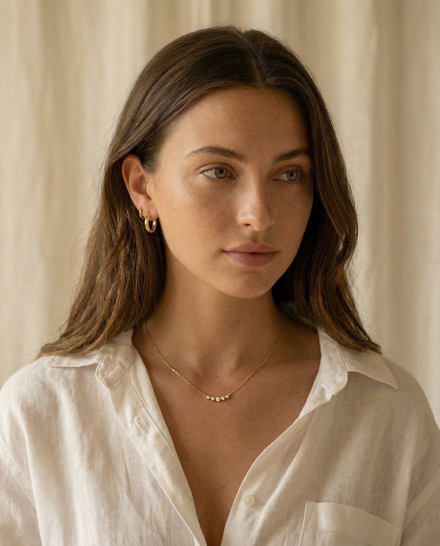 Lucia Gold Huggie Earrings