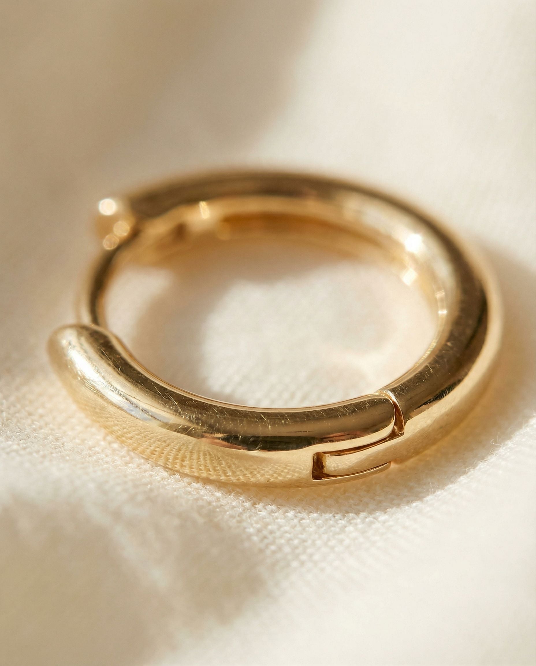 Lucia Gold Huggie Earrings